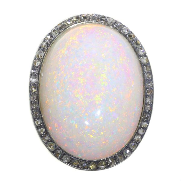 Vintage opal and diamond ring in gold and silver.