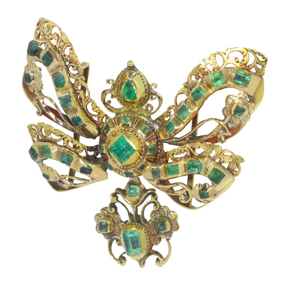 Baroque emerald bow pendant in gold.