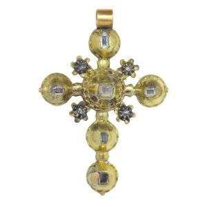 Antique diamond cross pendant in gold and silver.