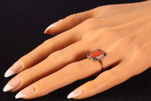 Art Deco diamond, coral and enamel ring in gold.