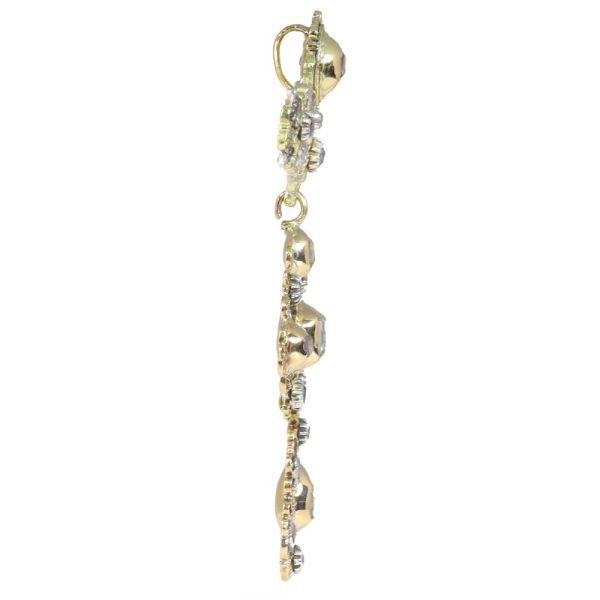 Baroque diamond pendant in gold and silver.
