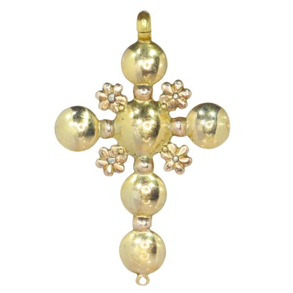 Baroque diamond cross pendant in gold.