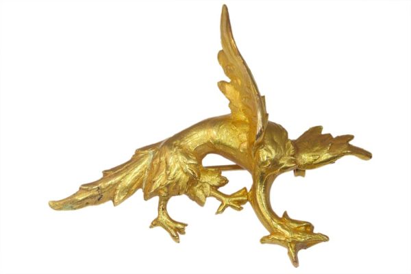 Antique gold griffin brooch.