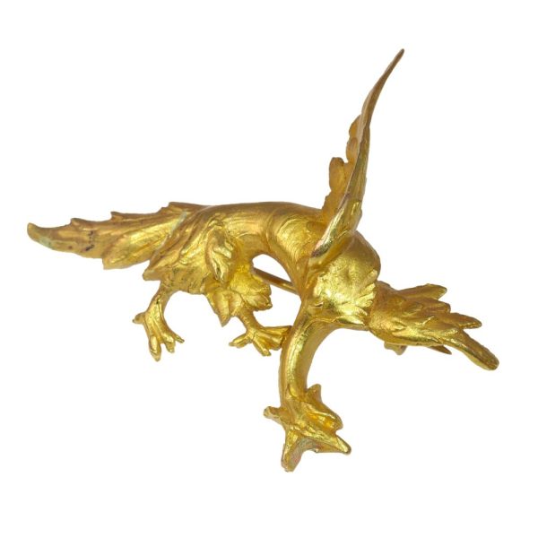 Antique gold griffin brooch.