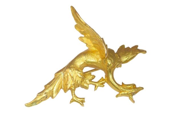 Antique gold griffin brooch.