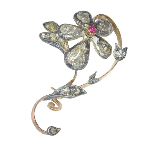 Victorian diamond and ruby brooch in gold and silver.
