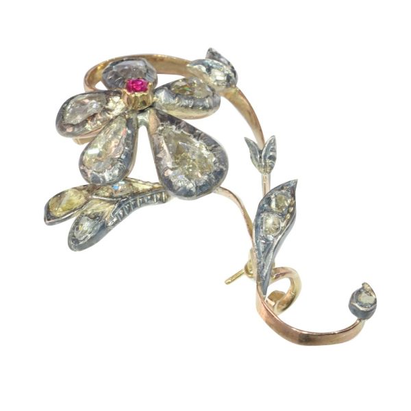 Victorian diamond and ruby brooch in gold and silver.