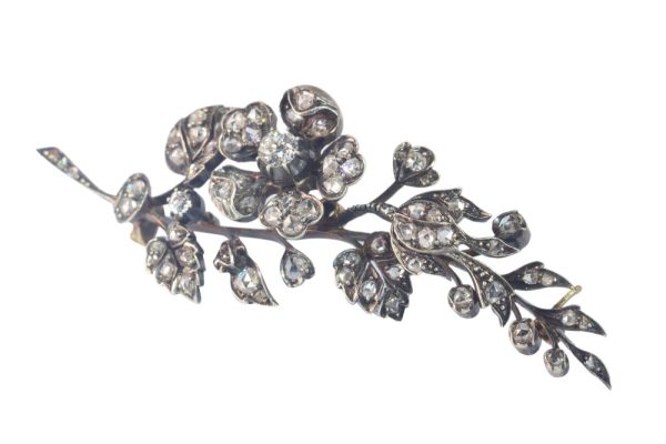Victorian diamond flower brooch in gold and silver.
