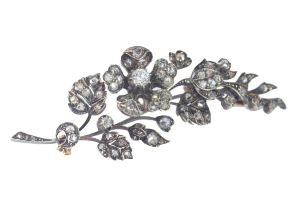 Victorian diamond flower brooch in gold and silver.