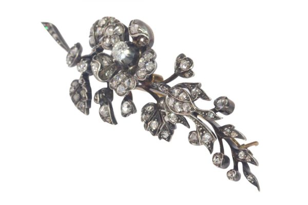 Victorian diamond flower brooch in gold and silver.