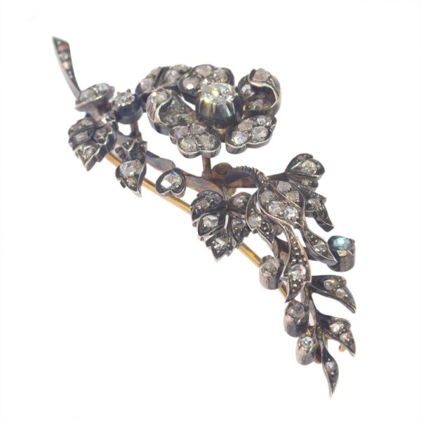 Victorian diamond flower brooch in gold and silver.