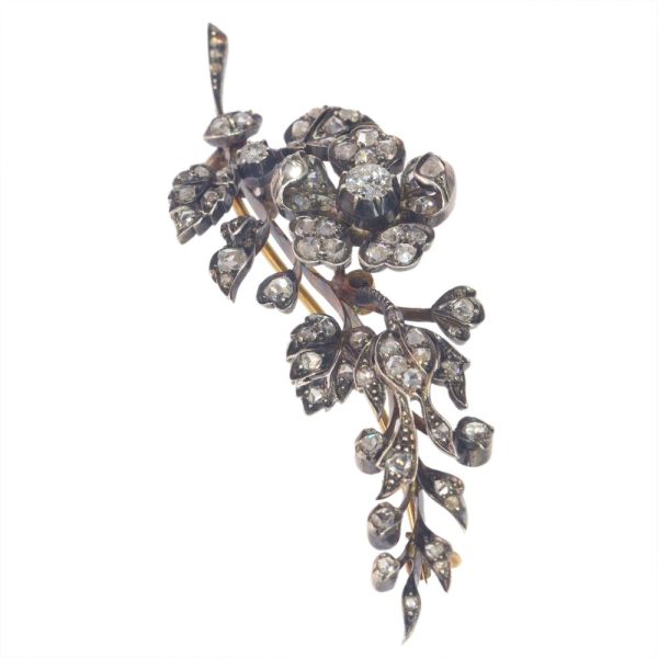 Victorian diamond flower brooch in gold and silver.