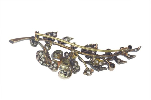 Victorian diamond flower brooch in gold and silver.