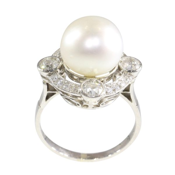 Art Deco pearl and old cut diamond ring in platinum.
