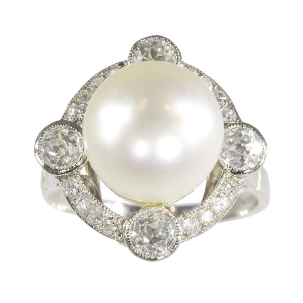 Art Deco pearl and old cut diamond ring in platinum.