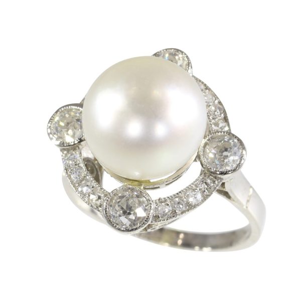 Art Deco pearl and old cut diamond ring in platinum.