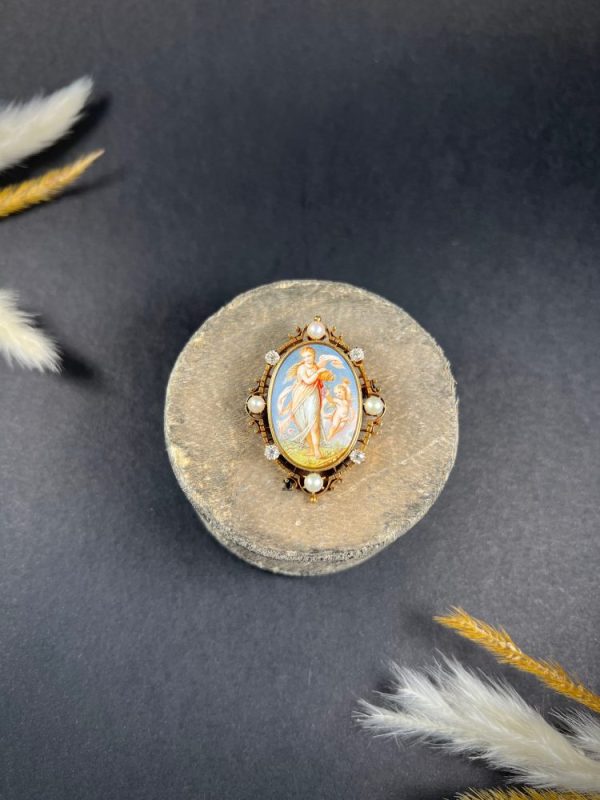 Antique enamel, pearl and diamond portrait brooch in gold.