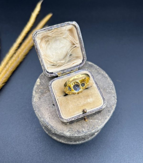Sapphire and diamond triple daisy ring in gold,
