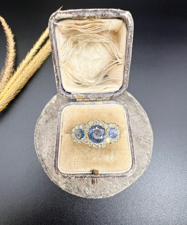 Sapphire and diamond triple daisy ring in gold,