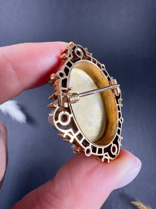 Antique enamel, pearl and diamond portrait brooch in gold.