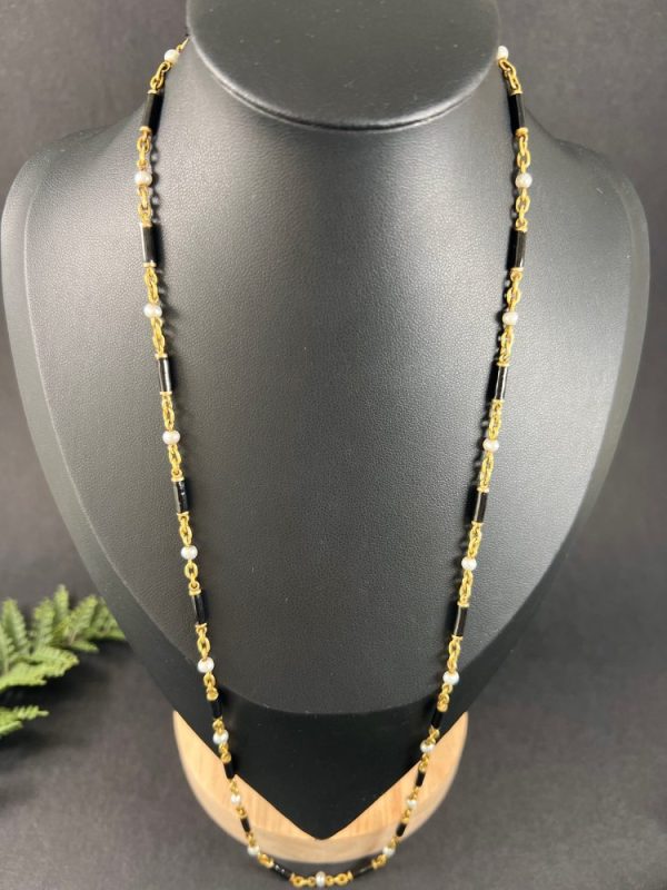Victorian enamel and pearl long necklace in gold,.