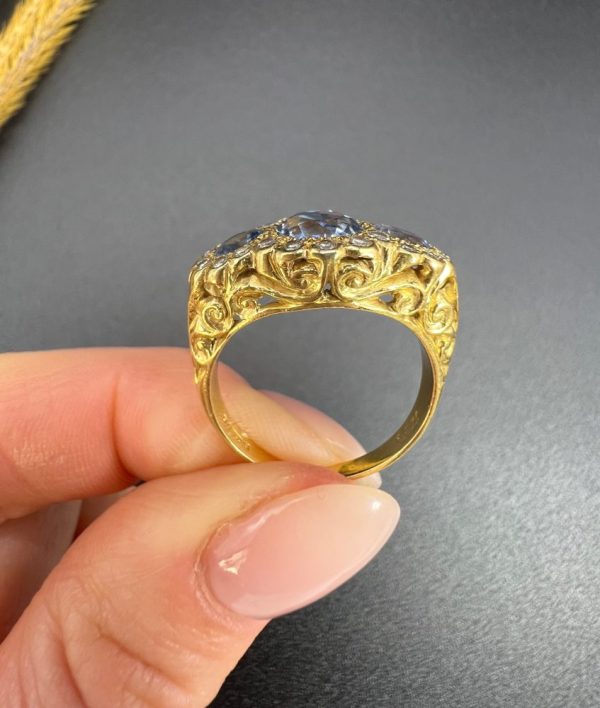Sapphire and diamond triple daisy ring in gold,