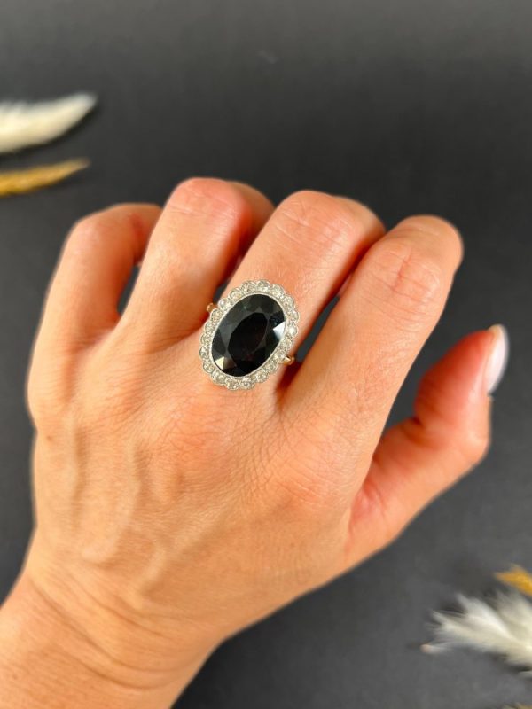 Antique sapphire and diamond cluster ring in gold and platinum.