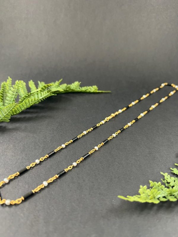 Victorian enamel and pearl long necklace in gold,.