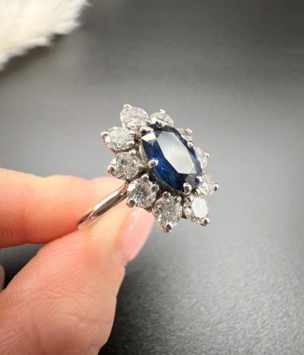 Sapphire and diamond cluster ring in white gold.