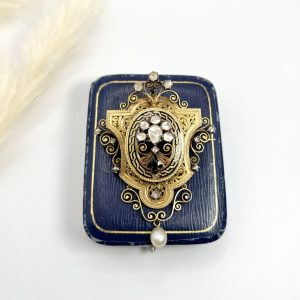 Antique diamond, enamel and pearl brooch in gold.
