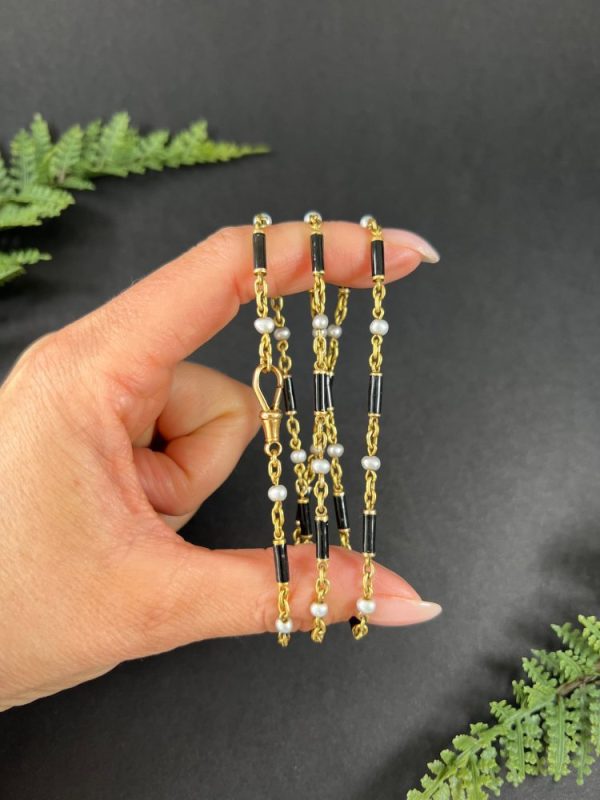 Victorian enamel and pearl long necklace in gold,.