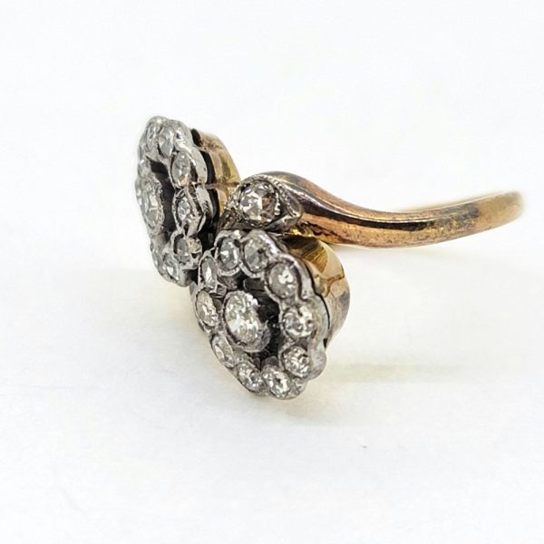 Victorian Antique Diamond Double Floral Cluster Ring, composed of two diamond flower clusters set with sparkling old-cut diamonds in 18ct yellow gold