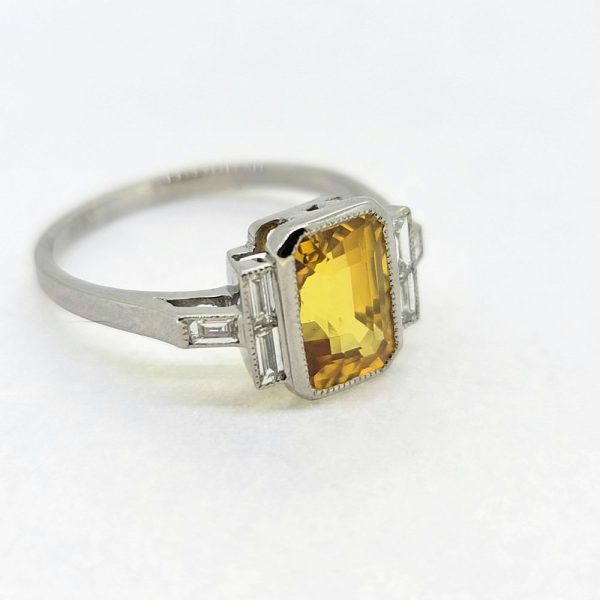 2.40ct Yellow Sapphire and Baguette Diamond Engagement Ring in Platinum, 2.40ct emerald-cut yellow sapphire flanked with baguette-cut diamonds
