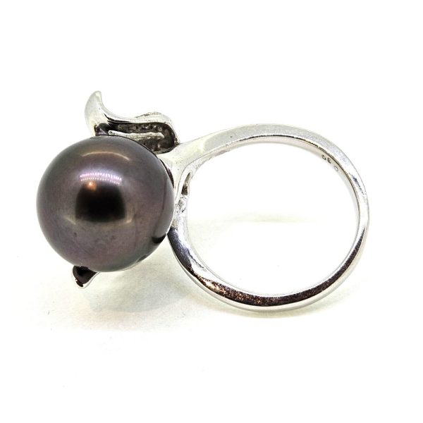 Contemporary Tahitian Pearl and Diamond Dress Ring, 13mm grey Tahitian pearl nestled within a diamond set leaf design mount in 18ct white gold