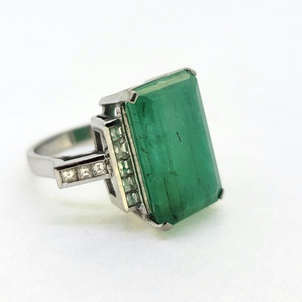 10cts Emerald Solitaire Ring with Square Cut Diamond Shoulders, 10ct single stone rectangular step-cut emerald flanked by square-cut diamond-set shoulders in 18ct white gold