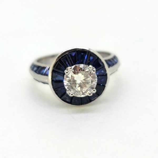 1ct Old Cut Diamond and Sapphire Target Cluster Engagement Ring, 1.01ct old-cut diamond surrounded by halo of tapered baguette cut sapphires in 18ct white gold