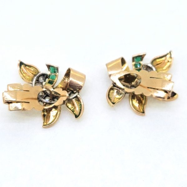 Emerald and Diamond Set Gold Earrings, striking pair of yellow gold earrings, each set with a line of diamonds accented with emerald stalks