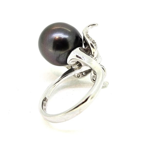 Contemporary Tahitian Pearl and Diamond Dress Ring, 13mm grey Tahitian pearl nestled within a diamond set leaf design mount in 18ct white gold