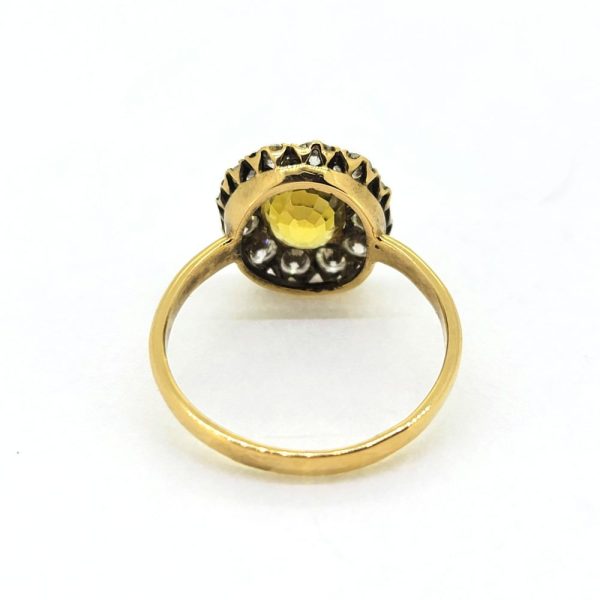 2ct Oval Yellow Sapphire and Diamond Cluster Engagement Ring, 2ct oval yellow sapphire surrounded by 0.80 carats of sparkling round brilliant-cut diamonds in 18ct yellow gold