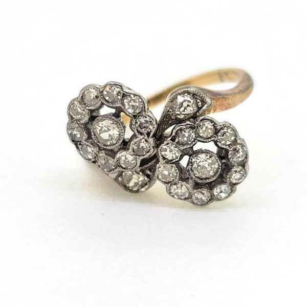 Victorian Antique Diamond Double Floral Cluster Ring, composed of two diamond flower clusters set with sparkling old-cut diamonds in 18ct yellow gold