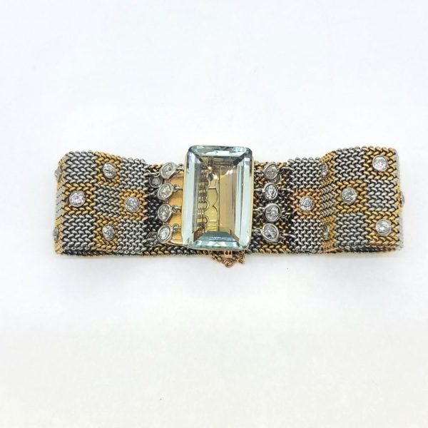 25ct Aquamarine and Diamond Set Bi Colour Gold Mesh Bracelet, square shaped 18ct yellow and white gold woven panels accented with diamonds to large rectangular step-cut aquamarine flanked by diamonds