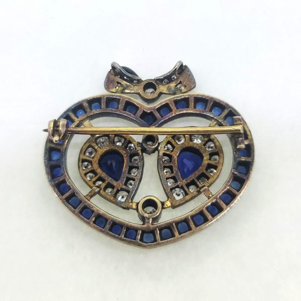 Victorian Antique Sapphire and Diamond Heart Bow Brooch, Two central pear cut sapphire and diamond clusters within sapphire heart shaped surround topped with diamond bow