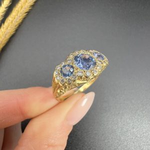Sapphire and diamond triple daisy ring in gold,