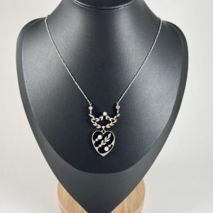 Edwardian heart pendant necklace in platinum and white gold with pearls and diamonds.