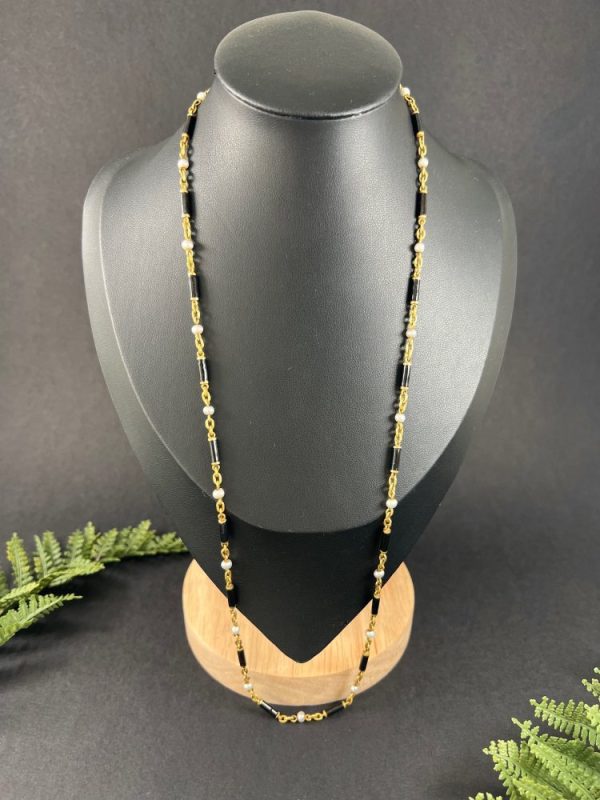 Victorian enamel and pearl long necklace in gold,.