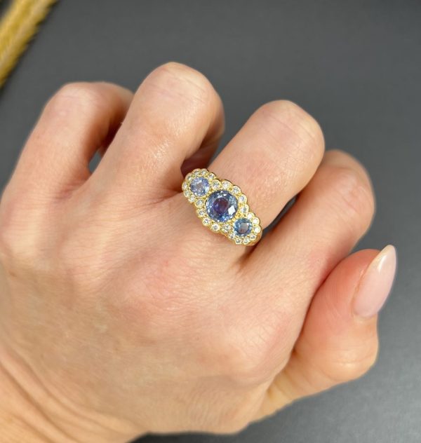 Sapphire and diamond triple daisy ring in gold,