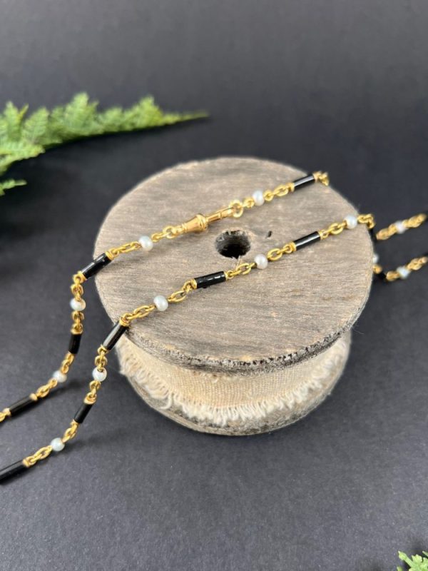 Victorian enamel and pearl long necklace in gold,.