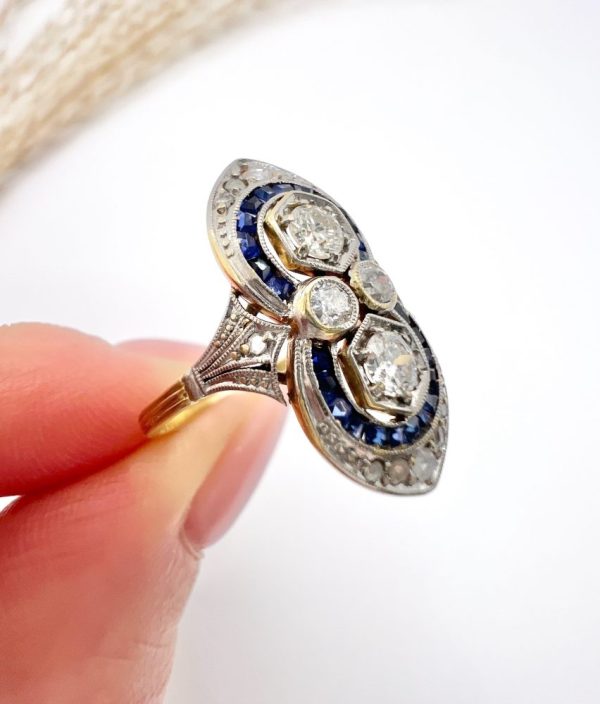 Art Deco diamond and sapphire ring in platinum and gold.