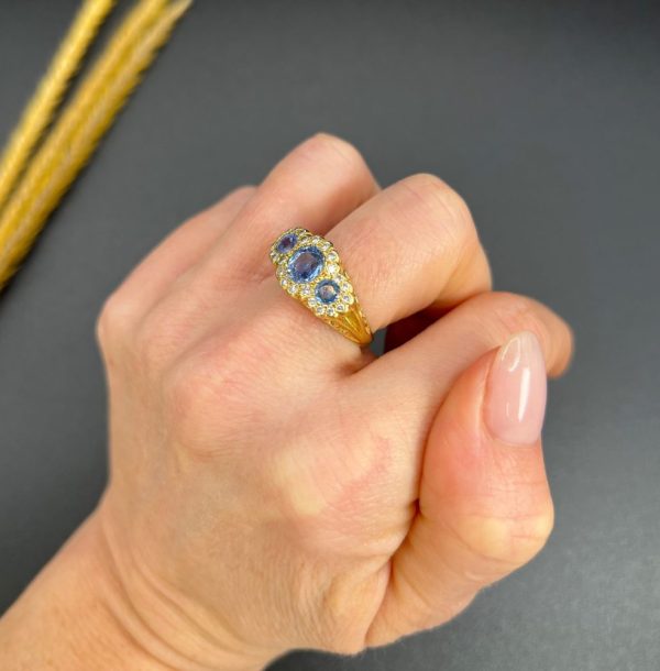 Sapphire and diamond triple daisy ring in gold,