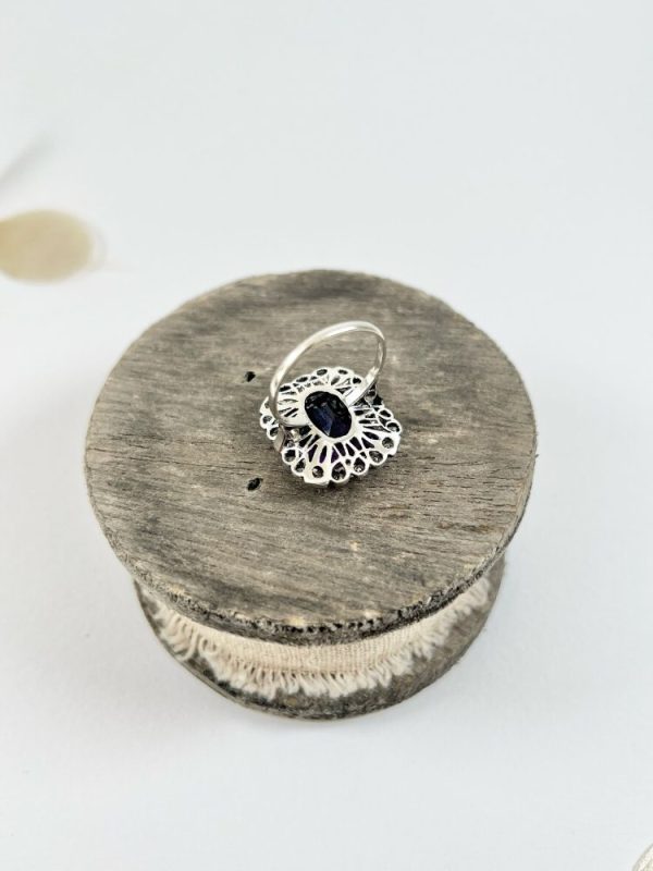 Antique amethyst and diamond cluster halo ring in white gold and platinum.
